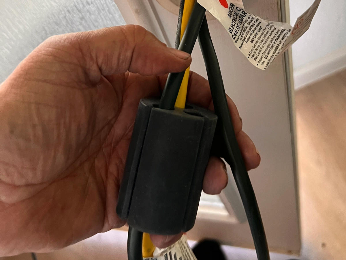 Compatible generator cords being loaded sideways into the prototype Inner Core
